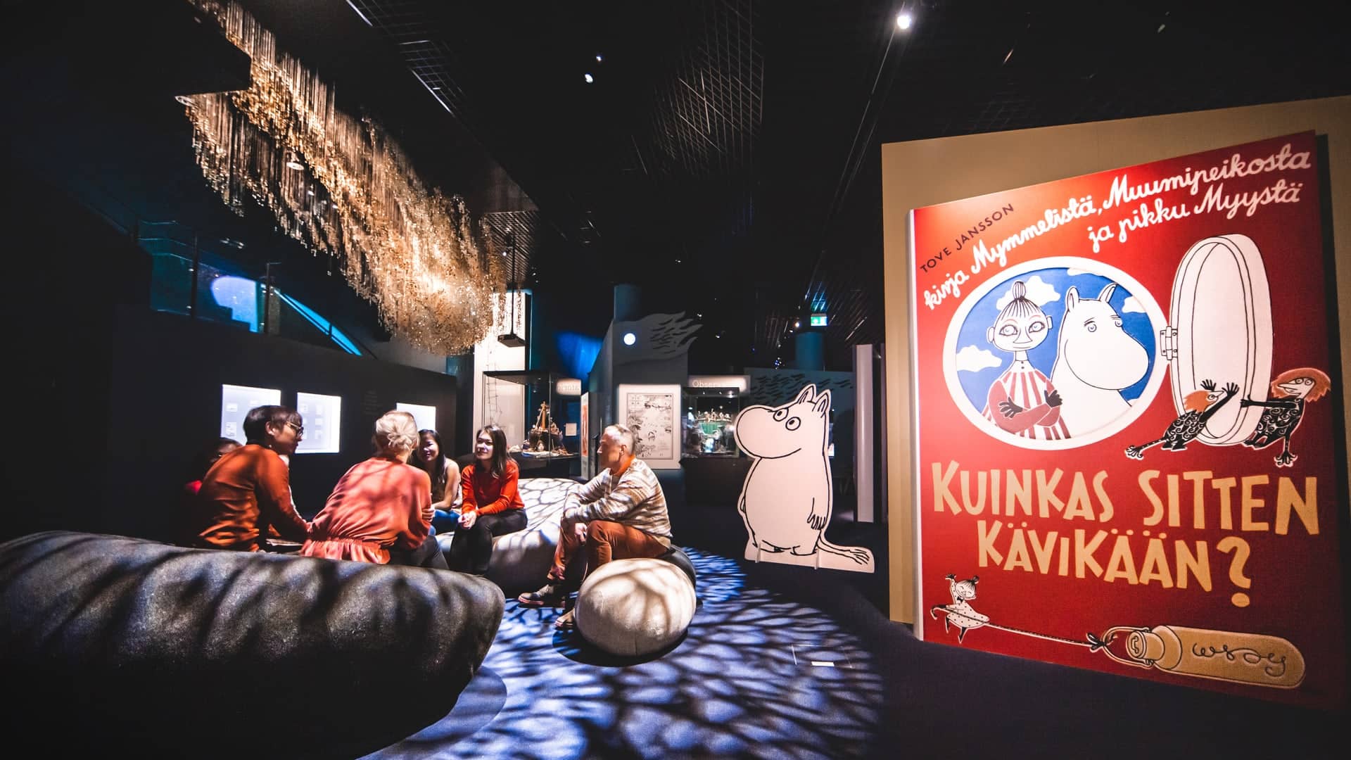 Customers are sitting on a Moomin Museum in Tampere