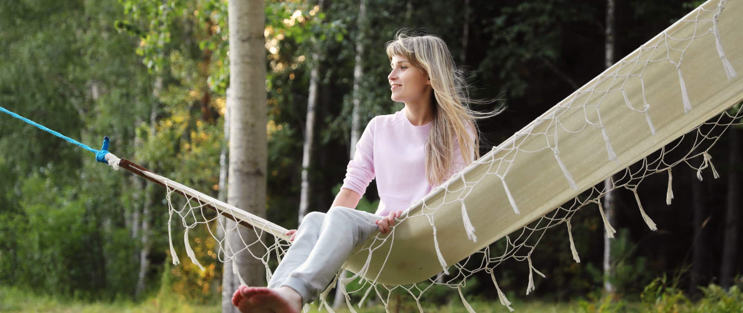 woman sitting in hammock in Finland