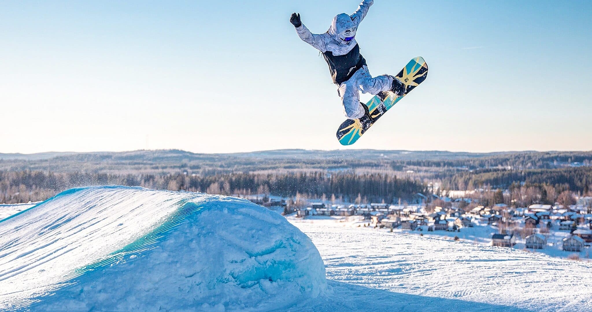 snowboarding in bright winter weather in Finland