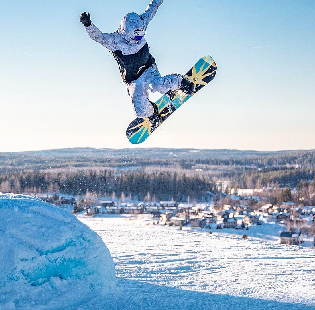 snowboarding in bright winter weather in Finland