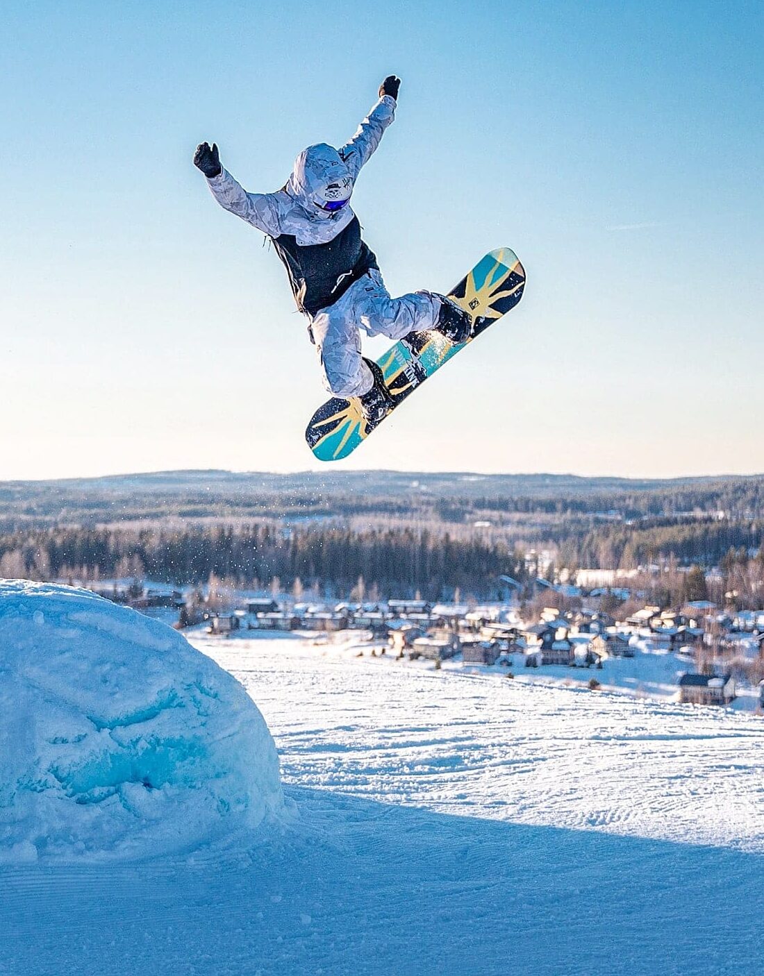 snowboarding in bright winter weather in Finland