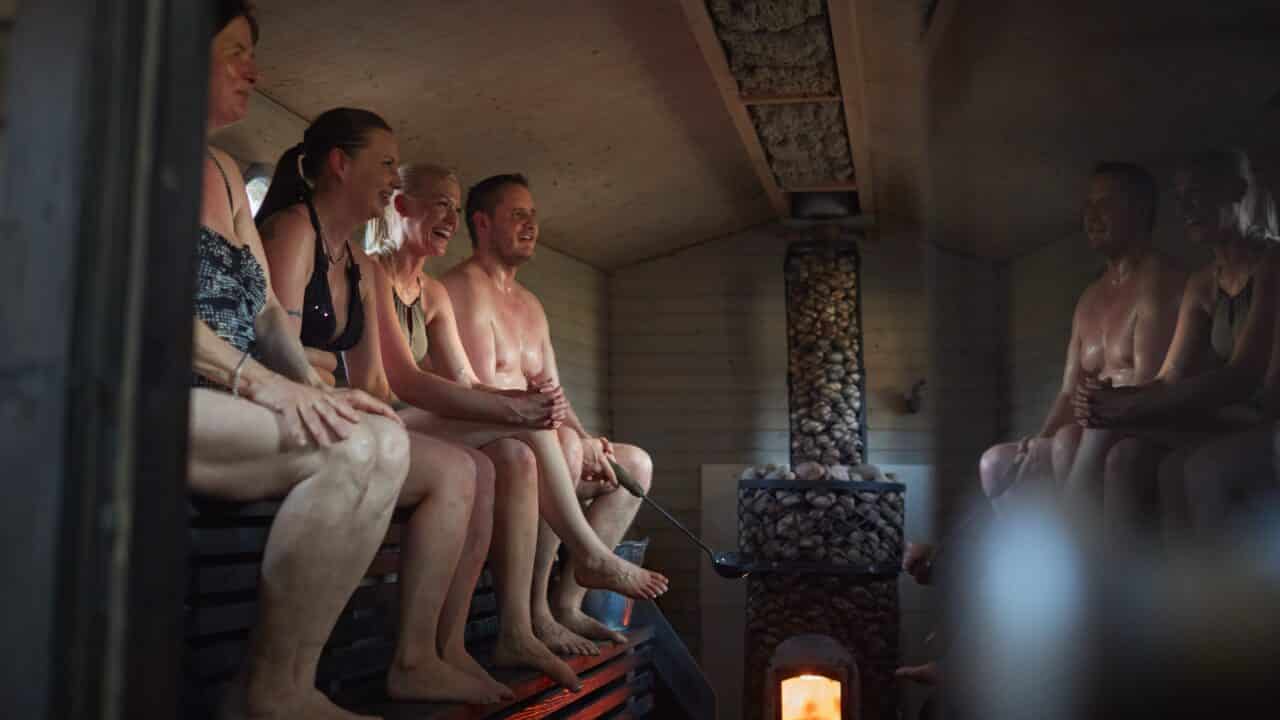 People sitting in a sauna
